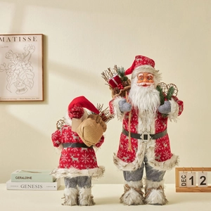 Standing Santa Claus figurines with snowflake knits and gift bags for festive home decor