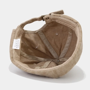 Detailed interior of khaki cotton docker hat showing stitching and adjustable strap