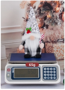 Detailed Christmas gnome featuring a sequined white hat and candy cane weight 65g