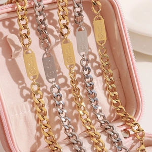 Cuban link bracelet in gold and silver finish featuring Happy Every Day smile engraving