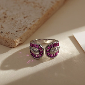 Detailed macro view of silver open ring with purple trapezoid gems and white stones