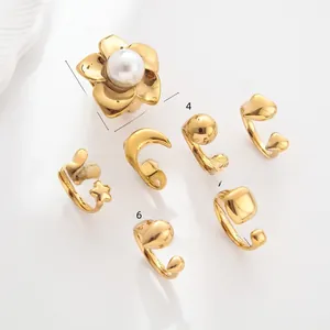 Detailed macro view of an 18k gold plated stainless steel floral ring with a pearl center