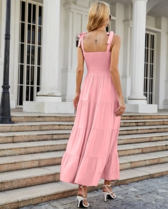 Back view of pink tiered dress with lace-up straps and elastic back detail