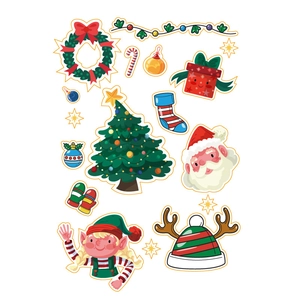 Flat lay of diverse Christmas stickers featuring Santa, reindeer, and festive elements