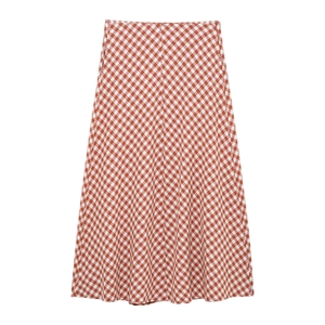 Detailed view of red and white gingham pattern on a long A-line skirt fabric