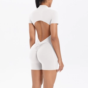 Detail of white yoga bodysuit featuring back cutout and scrunch butt lifting design