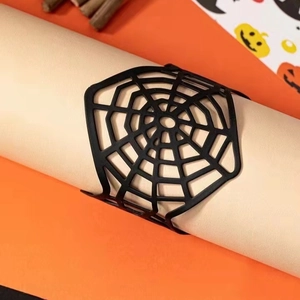 Gothic black spider web cuff bracelet on orange background for Halloween punk fashion