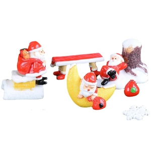 Nordic miniature Santa Claus figurines set with decorative tree stumps and gift bags