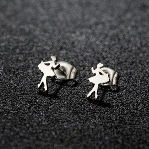 Macro detail of polished silver ballerina silhouette stud earrings with secure backings