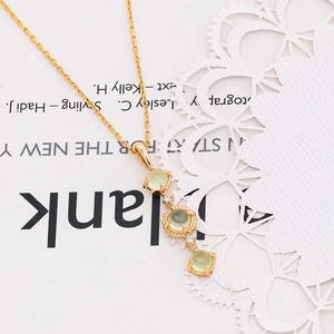 Detailed close-up of S925 silver necklace with three vertical oval green prehnite gems