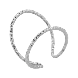 Macro view of silver ear cuff with double open design and diamond pyramid texture surface