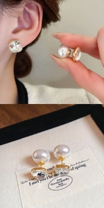 Detail of square crystal earrings with large pearl backings in 18K gold plated finish