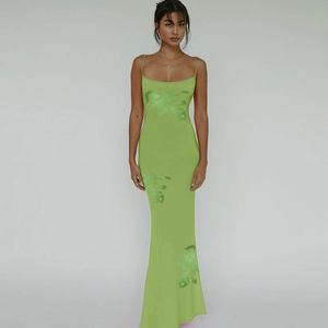 Detail view of the floral print and knit texture on this green slim fit maxi dress