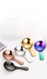 Five colorful 304 stainless steel dessert spoons shown in a vibrant fruit salad setting