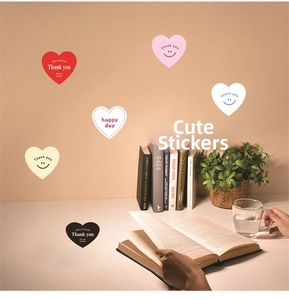 Close-up of heart-shaped aesthetic stickers for gift wrapping and journal decoration