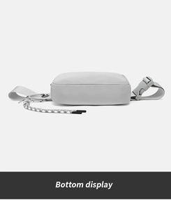 Bottom view of a lightweight waterproof nylon waist bag showing buckles and cord detail