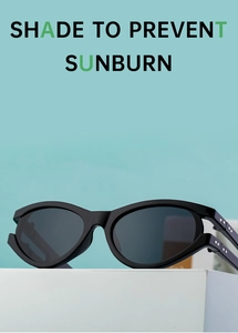 Detail of black oval frame sunglasses with metallic rivets on a blue background