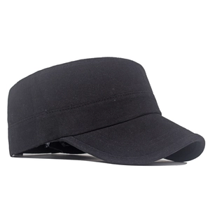 Detail of black cotton cadet cap showing the flat top structure and twill fabric texture