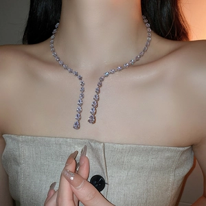 Macro shot of silver zircon water drop tassel choker with elegant dangling crystal detail