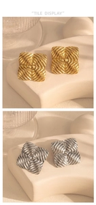 Detail view of geometric square stud earrings with ripple texture in gold and silver finish