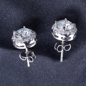 Detailed macro view of S925 sterling silver earrings with round moissanite in four-prong setting