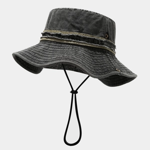 Detail of dark grey washed denim bucket hat showing vintage frayed edges and metal eyelets