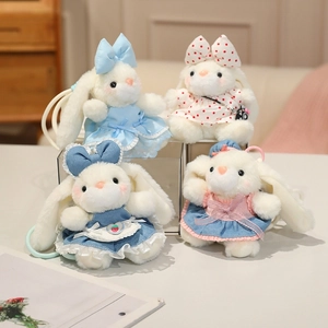 Set of four cute white plush bunny keychains with colorful dresses and matching bows