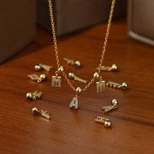 Gold MAMA letter necklace with sparkling cubic zirconia charms for women