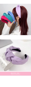 Close-up of wide knotted fabric headbands in pastel colors with anti-slip inner lining