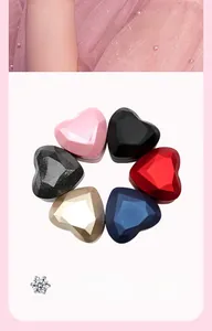 Selection of heart-shaped geometric jewelry boxes in various metallic and matte colors