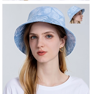 Front and side view of blue tie-dye cotton bucket hat worn by female model