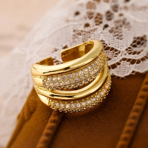Gold plated multi-layer open ring with sparkling zircon stones on velvet display