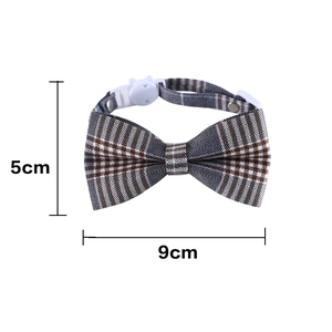 Detail view of British style plaid pet bowtie with adjustable buckle and size markers