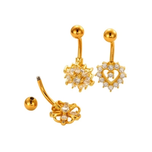 Golden belly rings set with heart and flower zircon designs on white background