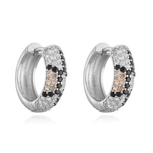 Close-up of leopard print hoop earrings with white black and pink pavé crystals