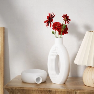 Modern Nordic white ceramic vase set with hollow oval shape and ribbed texture for home decor