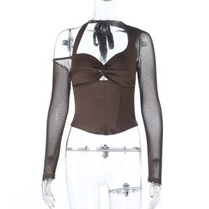 Detail of dark brown off-shoulder knit top with twisted mesh sleeves and corset waistline