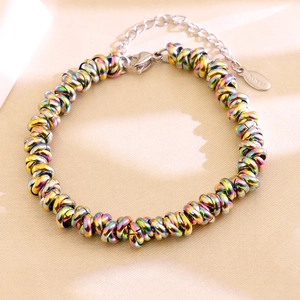 Detail of rainbow-colored stainless steel braided chain with lobster clasp and extension