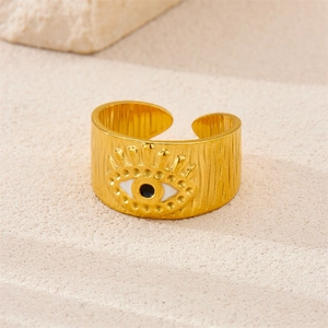 Macro detail of 18K gold-plated Evil Eye open ring showing textured metal finish