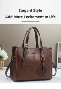 Detail of vintage brown tote bag with lychee texture, stitching and circular pendant