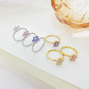 Set of minimalist floral rings with colorful zircon petals in gold and silver plating