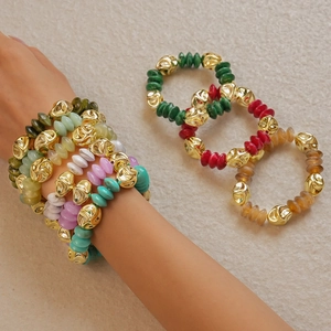 Detail of colorful acrylic beads and irregular 18K gold textured metal beads on the bracelet