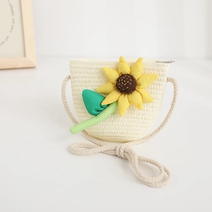 Detail of a beige woven crossbody bag for kids featuring a 3D sunflower and green leaves