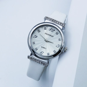 Elegant white quartz watch for women with rhinestone-set silver case and leather strap