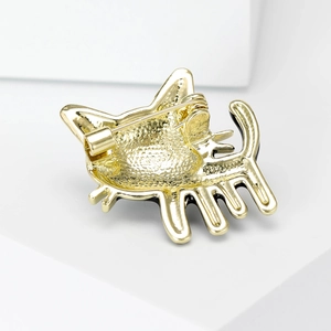 Back view of cute cat brooch in gold alloy with safety pin and enamel details