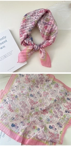 Detail of pink cotton-linen square scarf with floral print and butterfly patterns