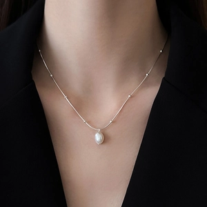 Minimalist silver stainless steel necklace with irregular pearl pendant on a beaded chain