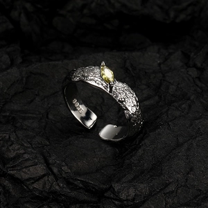 S925 sterling silver lava texture open ring with oval yellow gemstone on dark background