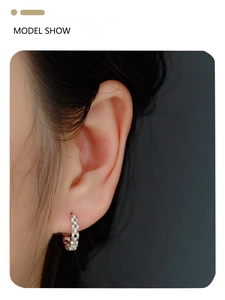 Model wearing S925 silver chain hoop earrings with diamonds in a stylish side view profile