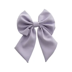 Elegant large lavender fabric bow hair clip with textured twill design for women